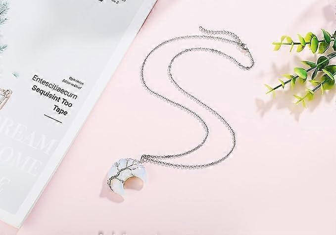 Crescent moon pendant necklace with silver chain, wire-wrapped tree of life and crystal charm