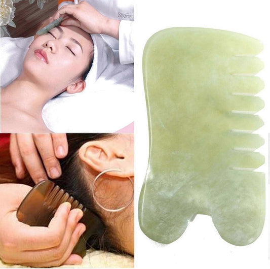 Jade gua sha massage comb held in hand, curved shape with five prongs
