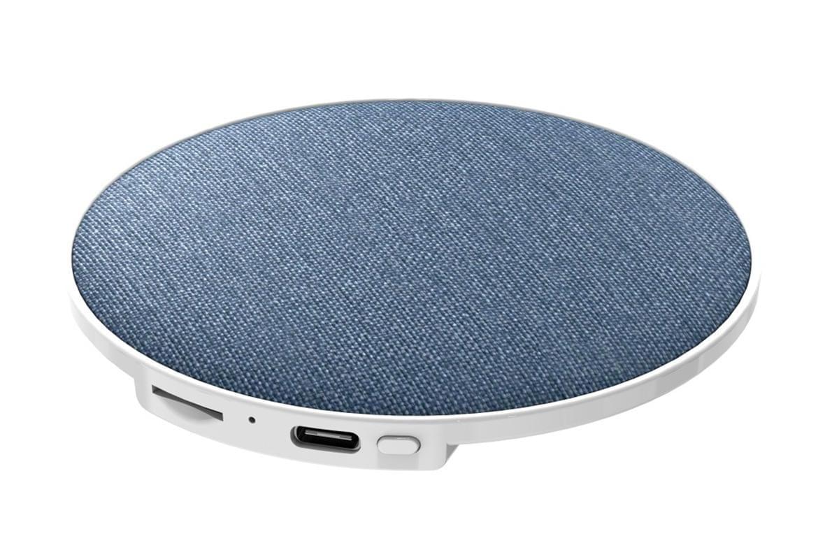 Round blue fabric wireless speaker puck with white base and front buttons