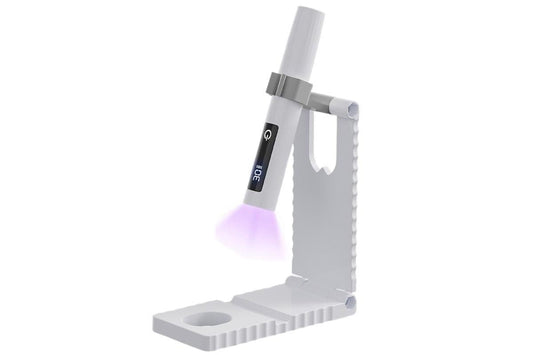 White mini LED nail lamp with touch timer, turned on with purple glow
