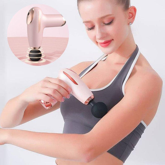 Pink handheld percussion massager with black ball head used on an arm