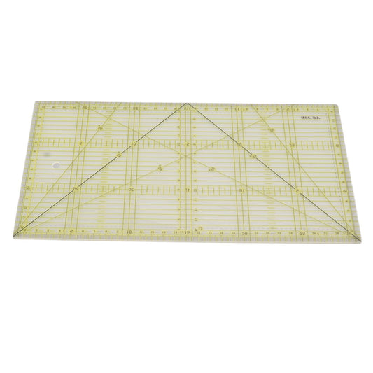 Clear quilting ruler with intersecting scale lines and large triangular corner markings