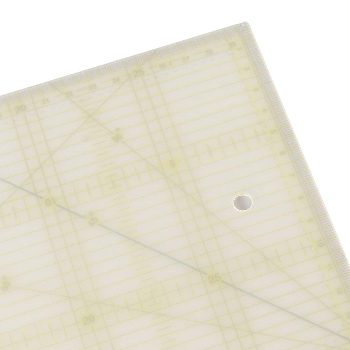 Transparent acrylic quilting ruler with grid lines and a round mounting hole