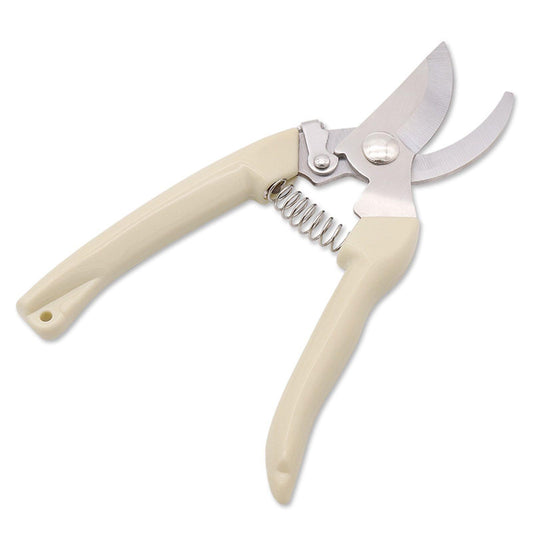 Garden shears with curved stainless blades, cream handles, and coil spring