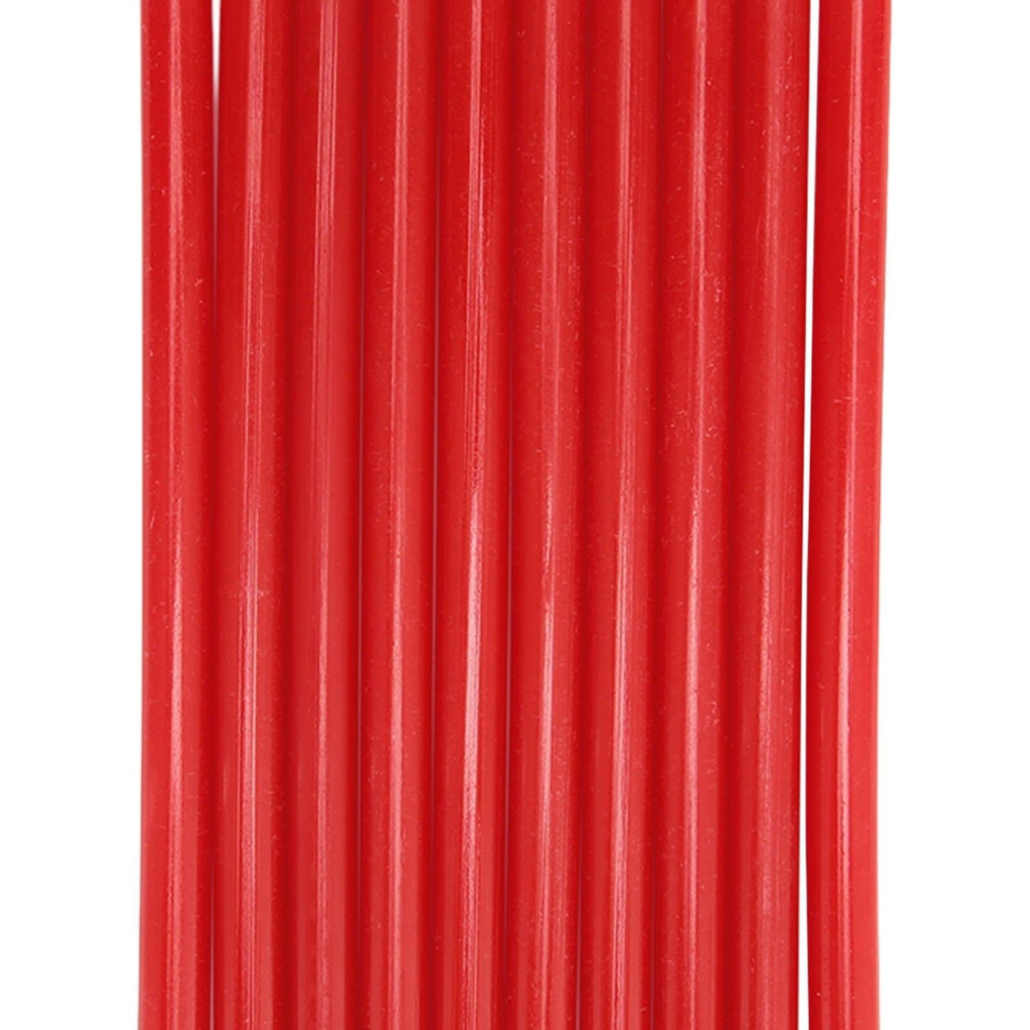 10 hot melt glue sticks, close-up of red ridged surface.