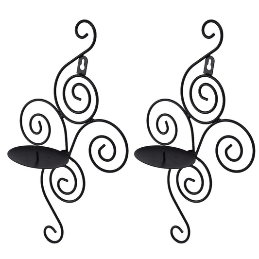 Two wall-mounted candle holders with spiral arms and wide black candle plates.