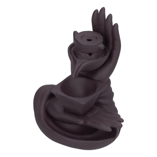 Ceramic incense burner with stacked hands and a round top incense holder
