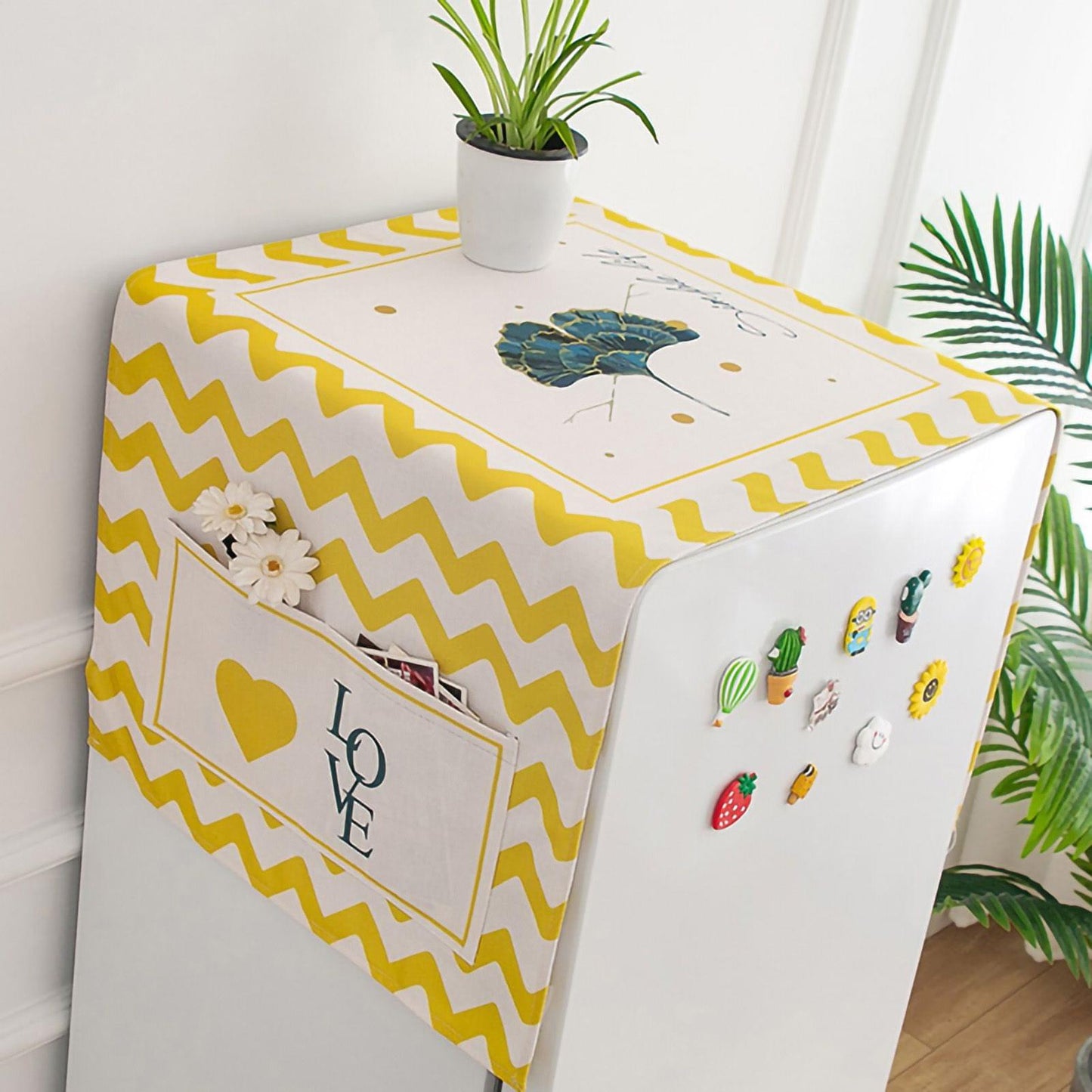 Yellow and white appliance dust cover with chevron pattern and multicolor cactus motifs
