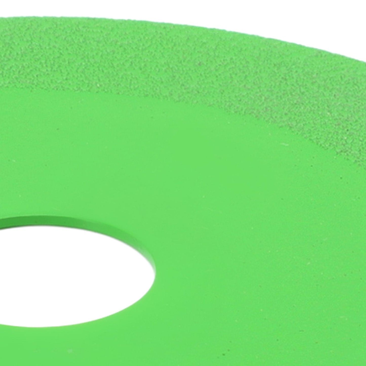 Green diamond cutting disc for glass, close-up of edge and partial center hole
