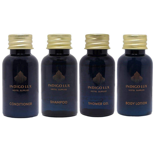 Hotel toiletries set of four mini bottles with gold caps