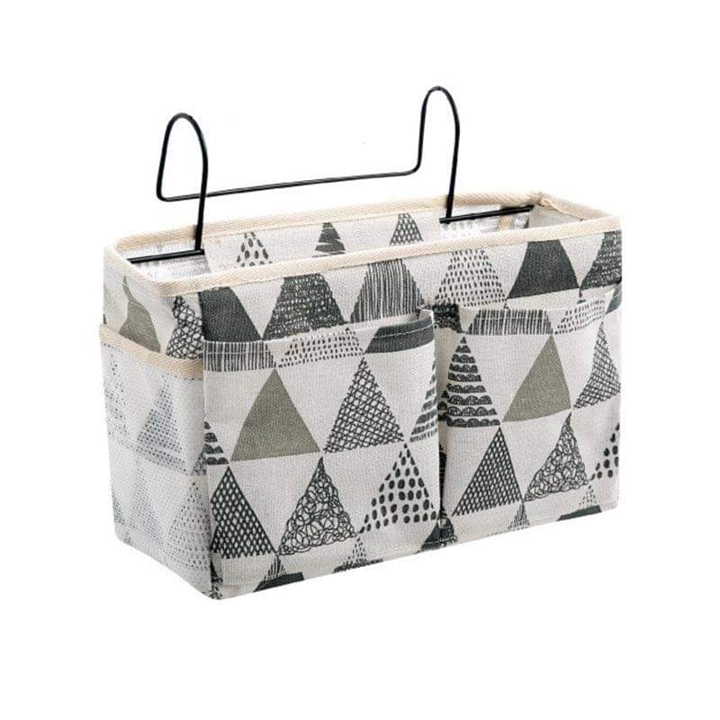 Hanging bedside storage caddy with pockets, white with black triangle and tree pattern