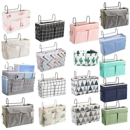 Hanging bedside storage caddy with several pocket styles and metal hanging hooks