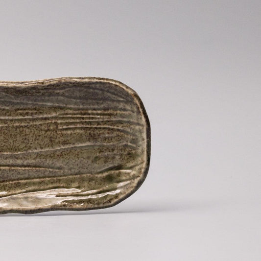 Rectangular sage glaze plate with ribbed texture and curved edges