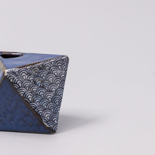Triangular indigo wave vase corner view with white wave pattern and rim opening
