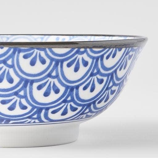Ceramic bowl side view with blue decorative crest pattern and dark rim