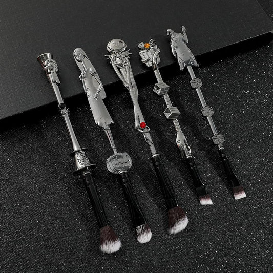 Skeleton makeup brush set, five metal brushes with jack and skull heads, black bristles