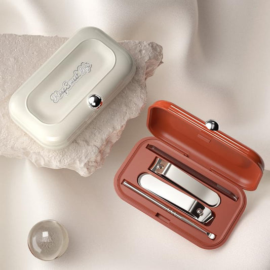 Manicure kit set with open red case showing clippers and file, plus closed white case