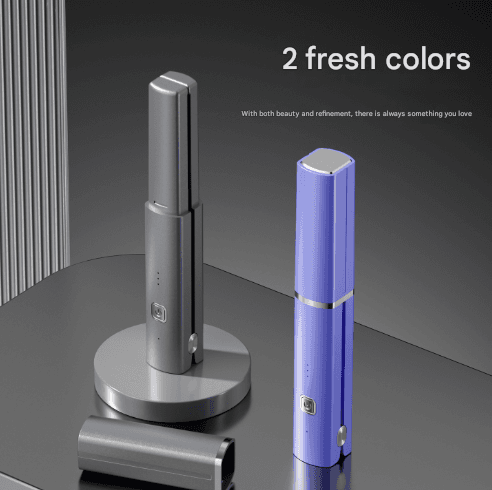 Cordless mini hair straightener in purple and dark gray on charging stand