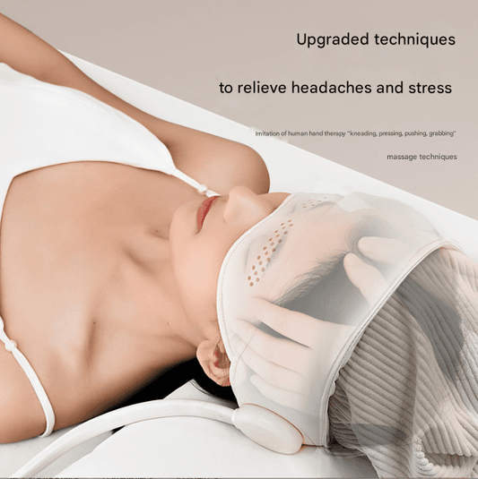 White head massage hat with inflatable pads resting against the face and sides of head