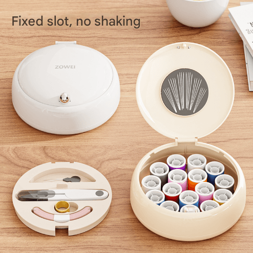 White compact sewing organizer with open lid and divided compartments, accessories inside.