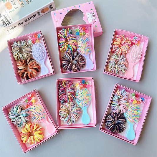 Pink hair accessory gift boxes with multicolor spiral hair ties and mini combs