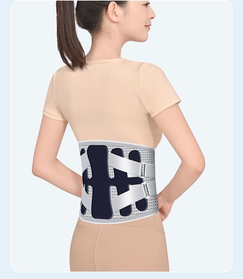 Back view of dark navy lumbar support belt with grey adjustable straps on model