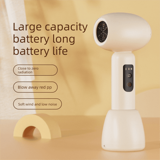 White handheld baby hair dryer with side vented nozzle and button control