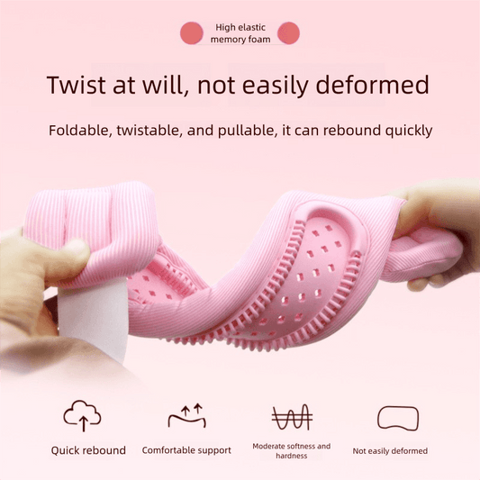 Pink cervical support neck brace folded by hands, with perforated inner support