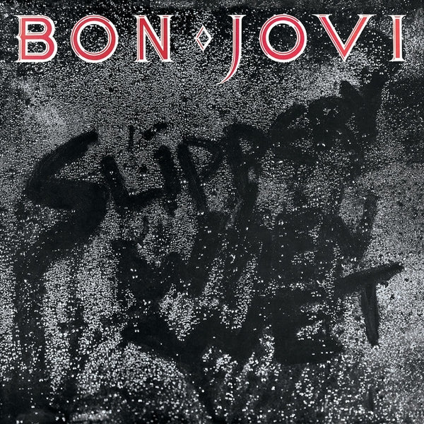 Vinyl album cover with Bon Jovi title in red and white over dark glitter artwork