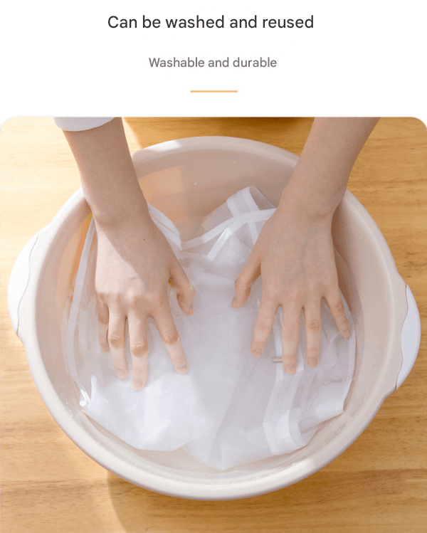 Translucent garment bag being washed by hands in a basin