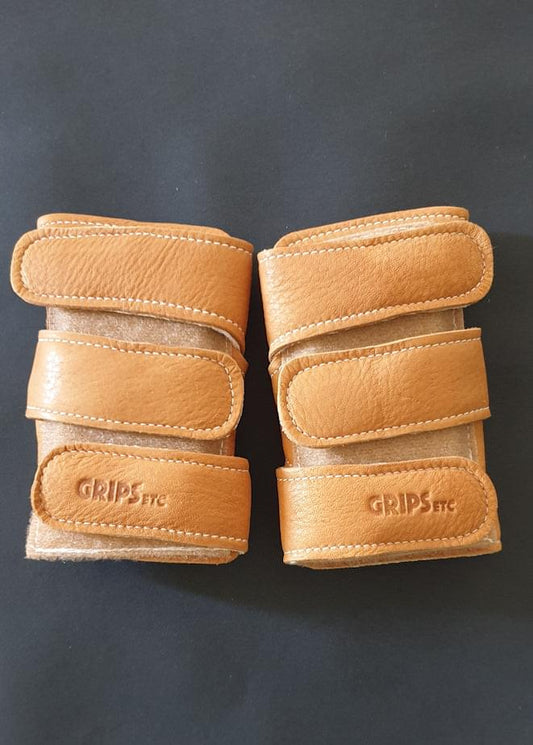 Tan leather wrist savers, two-piece set with GRIPstc logo Velcro tabs