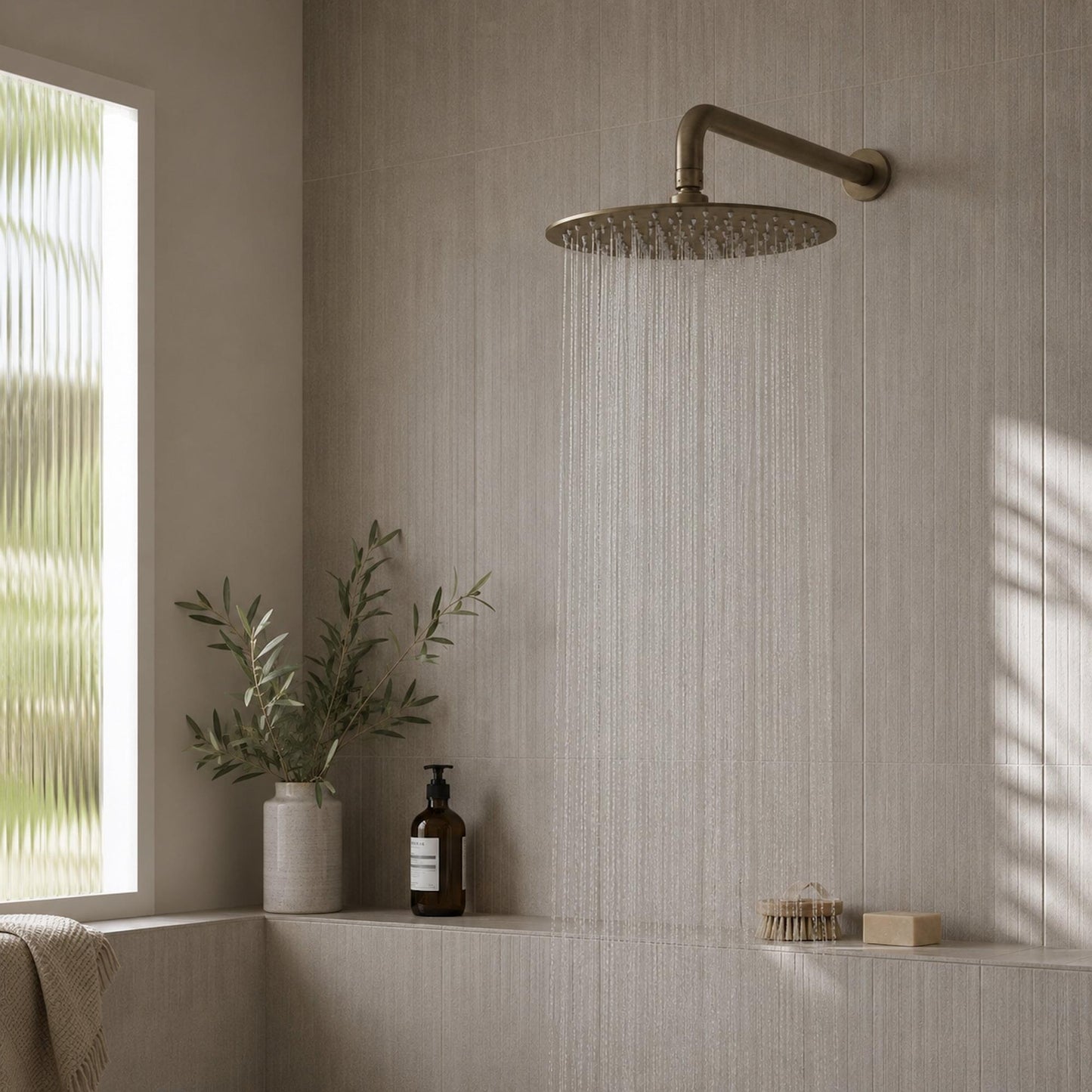 Rainfall shower system with round shower head and antique brass shower arm, overhead