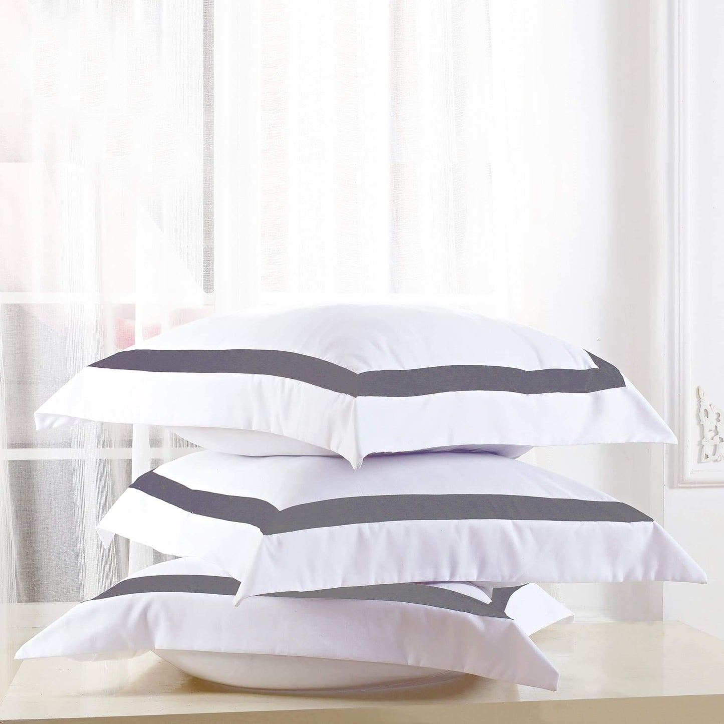 Set of white European pillowcases with charcoal horizontal stripe accents
