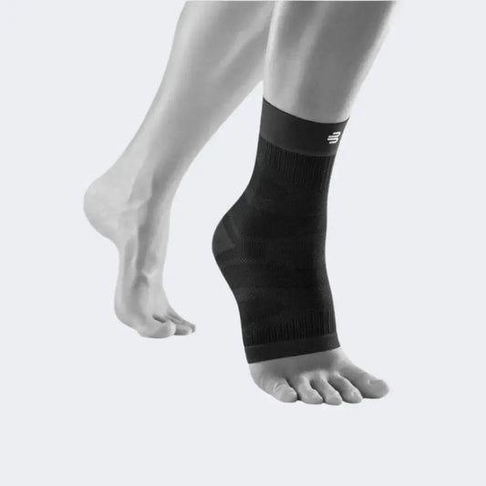 Black compression ankle sleeve with ribbed knit cuffs and textured support panel
