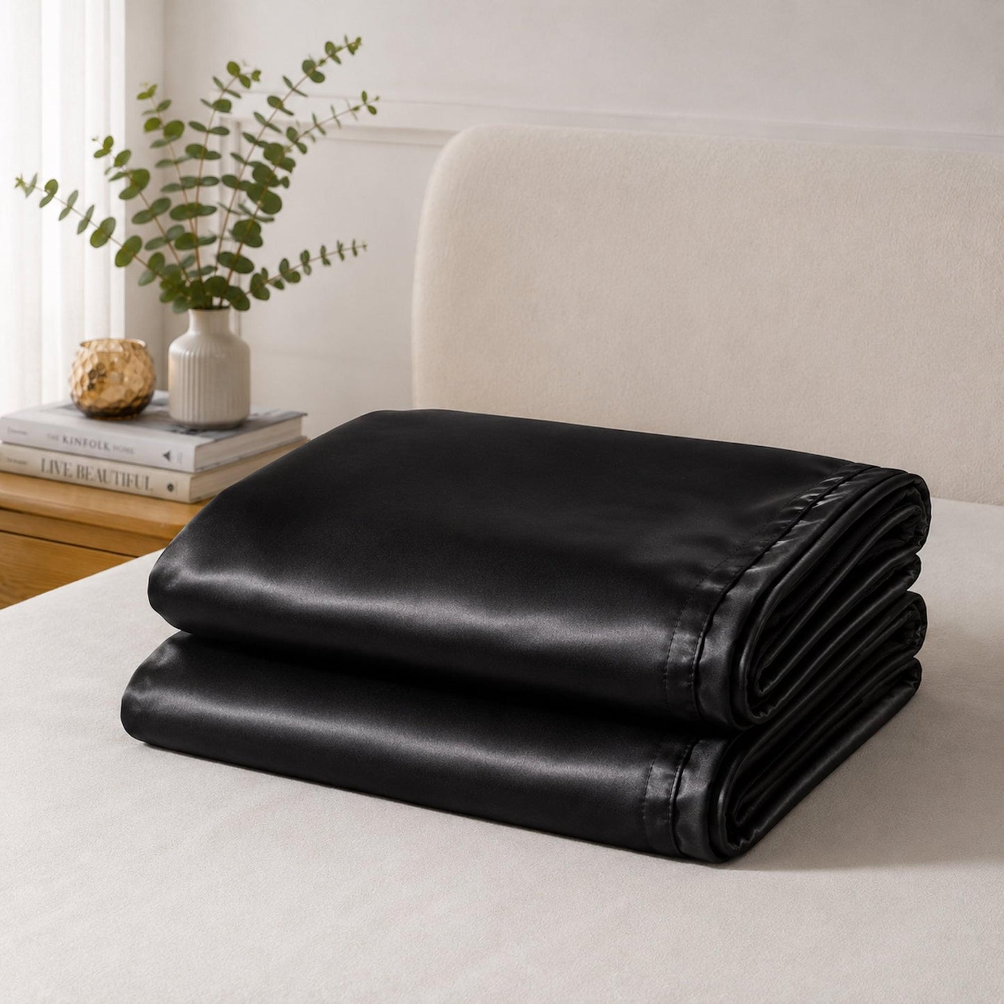 Black satin pillowcase set, neatly folded satin fabric bundle
