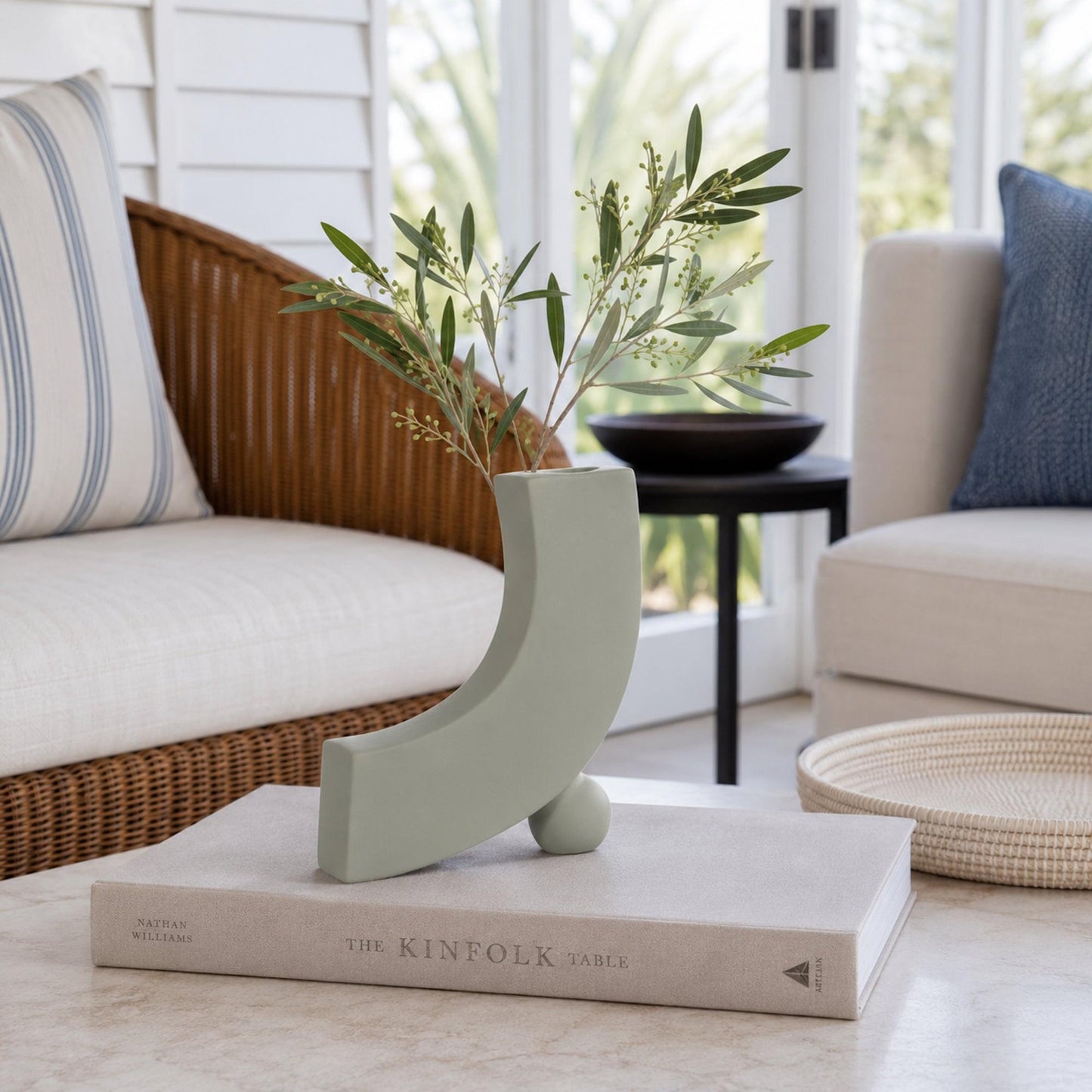 Sage grey ceramic blossom vase with greenery, curved crescent cutout design