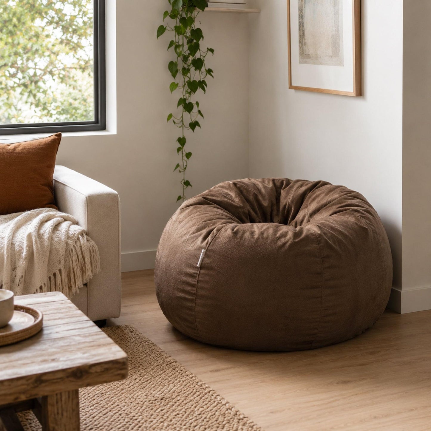 Brown round bean bag chair with gathered top in soft fabric