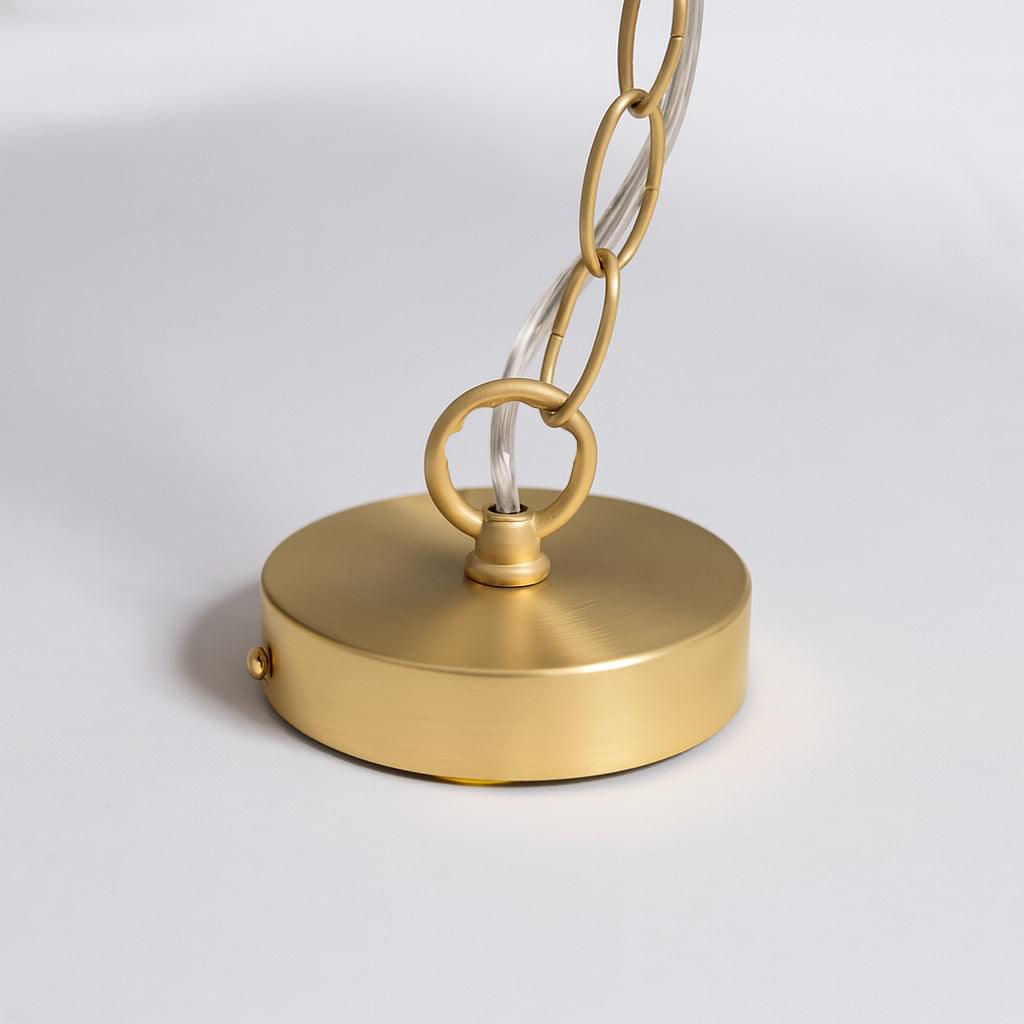 Gold round canopy with hanging chain and clear glass pendant shade