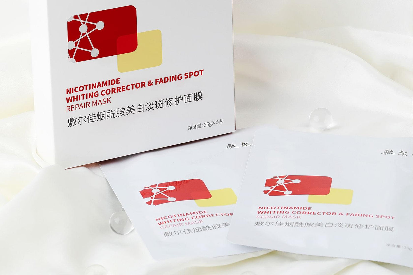 VOOLGA nicotinamide whitening corrector mask boxes and sachets on light fabric