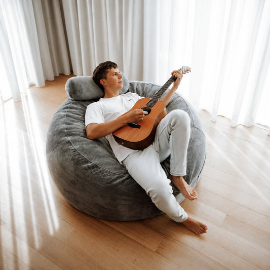 Gray round beanbag chair liner with built-in headrest for lounging