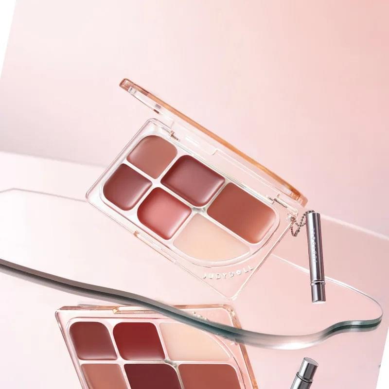 JUDYDOLL clear 6-color lip palette compact with shades and lip brush, angled view