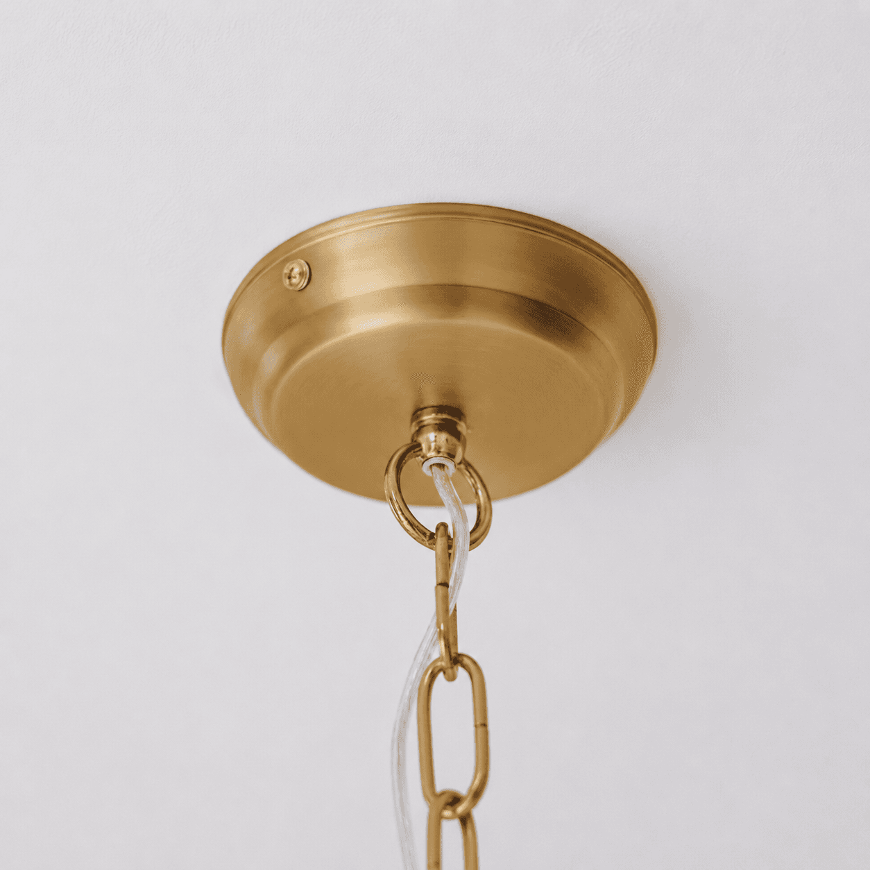 Gold ceiling canopy with hanging loop and chain connection for pendant light