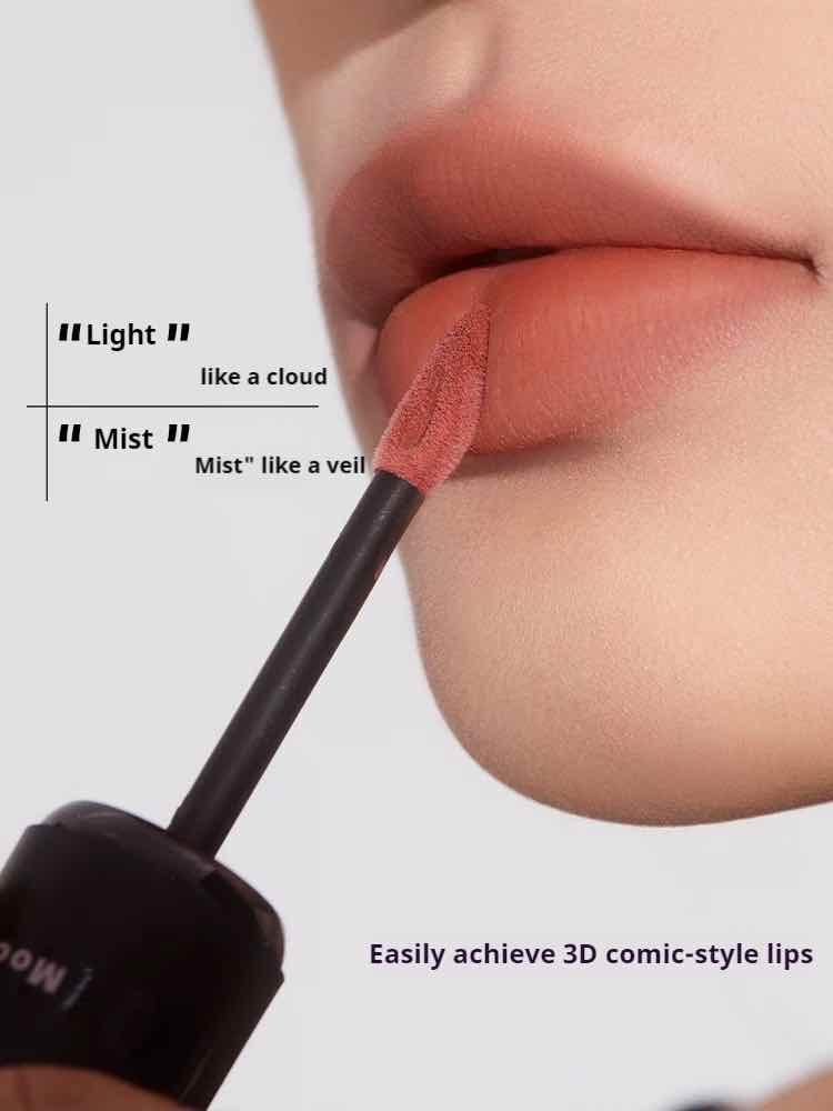 Lip mud wand applying pink-red tint to lips