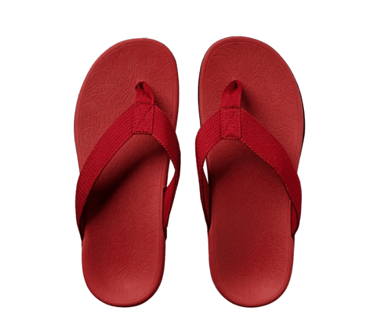 Pair of wine red flip flops with textured footbeds and red thong straps