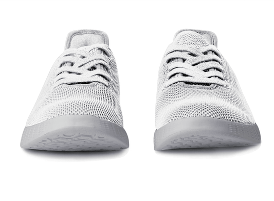 White knit lace-up sneaker, front view with rounded toe and cushioned low sole