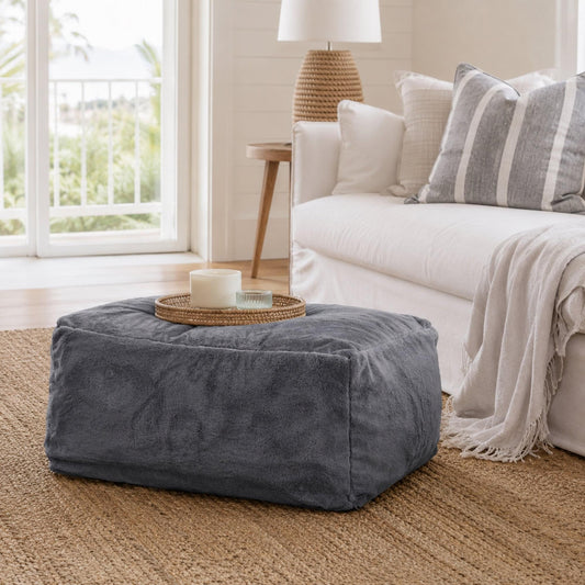 Charcoal gray fabric ottoman, low cube shape