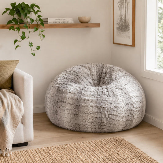 Silver gray round bean bag with plush faux-fur cover for lounging