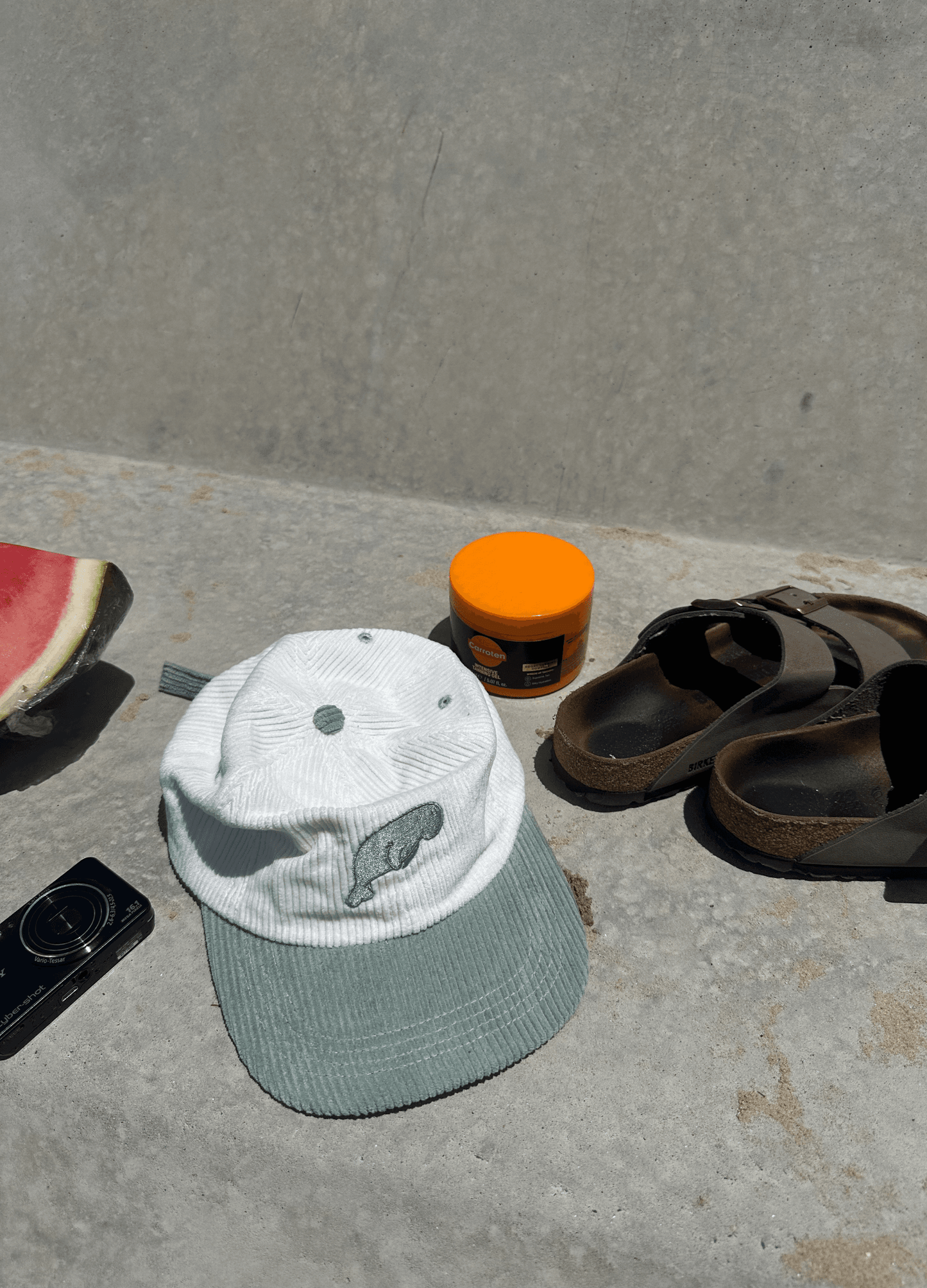 Dugong graphic cap, white ribbed crown and mint brim, green emblem patch