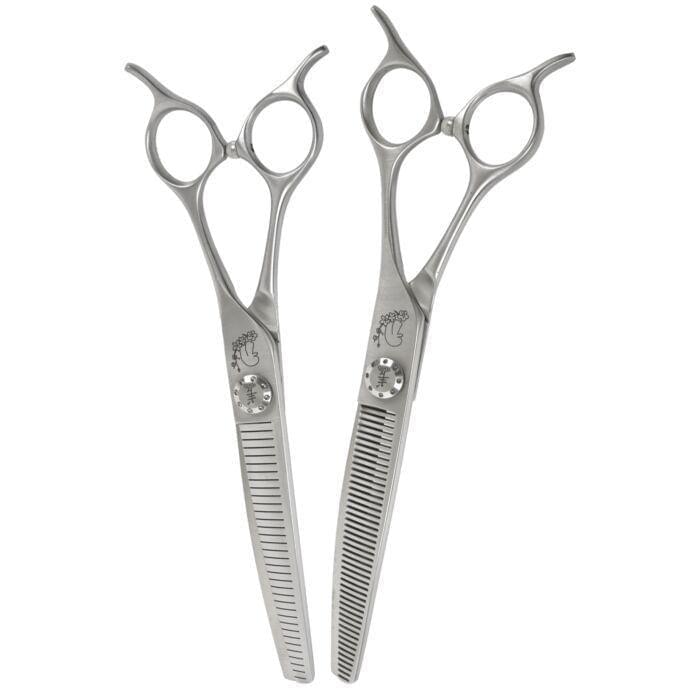 Pair of curved stainless hair blending scissors with comb teeth and matching loop handles.
