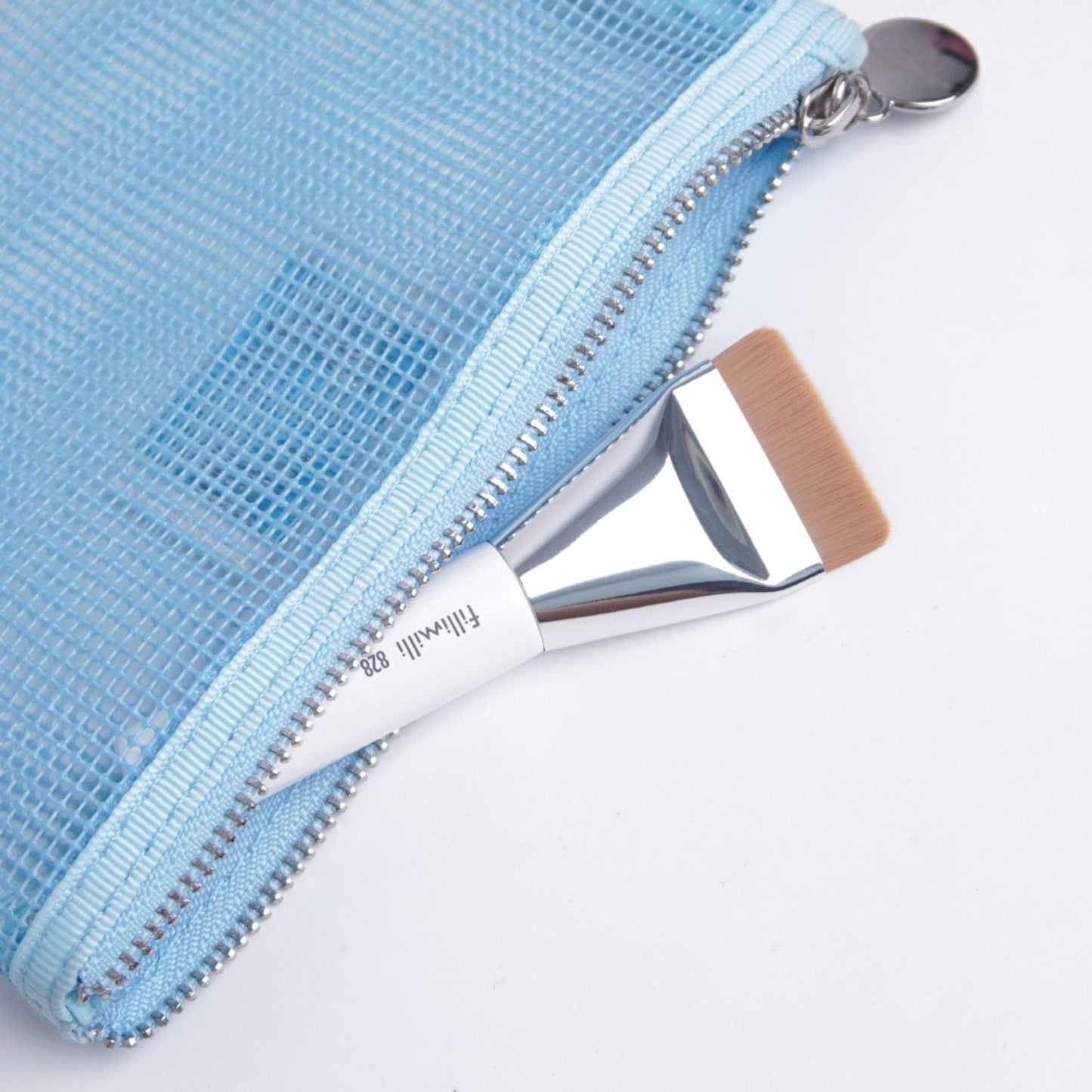 Fillimilli 828 mini spatula brush beside light blue zip pouch with metal zipper